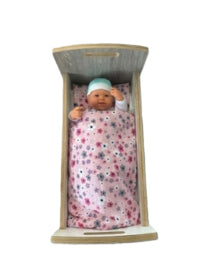 Doll's bed with matching bedding
