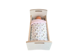 Doll's bed with matching bedding