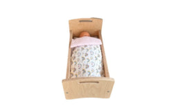 Doll's bed with matching bedding