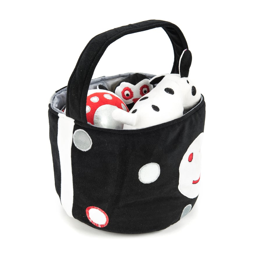 Black and white soft baby toys in basket, contrasting