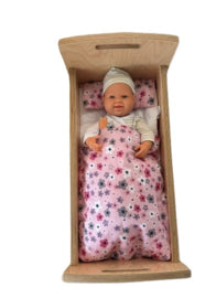 Doll's bed with matching bedding