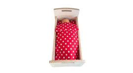 Doll's bed with matching bedding