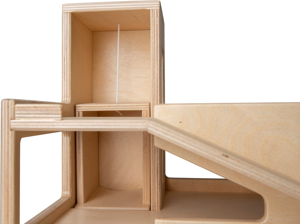 Two-story wooden parking garage with elevator
