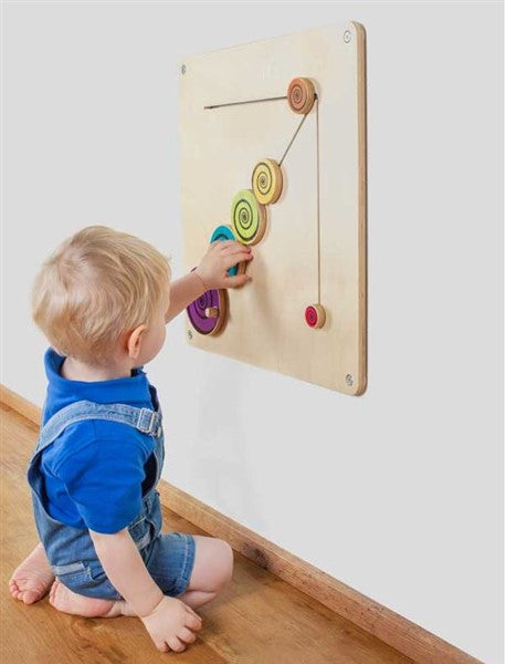 Wandbord met roterende houten schijven